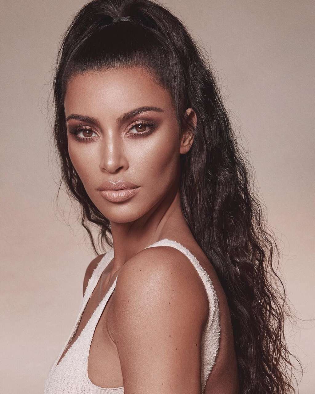 Kim Kardashian Steps Out in Low-Cut Look With Her Perfume 